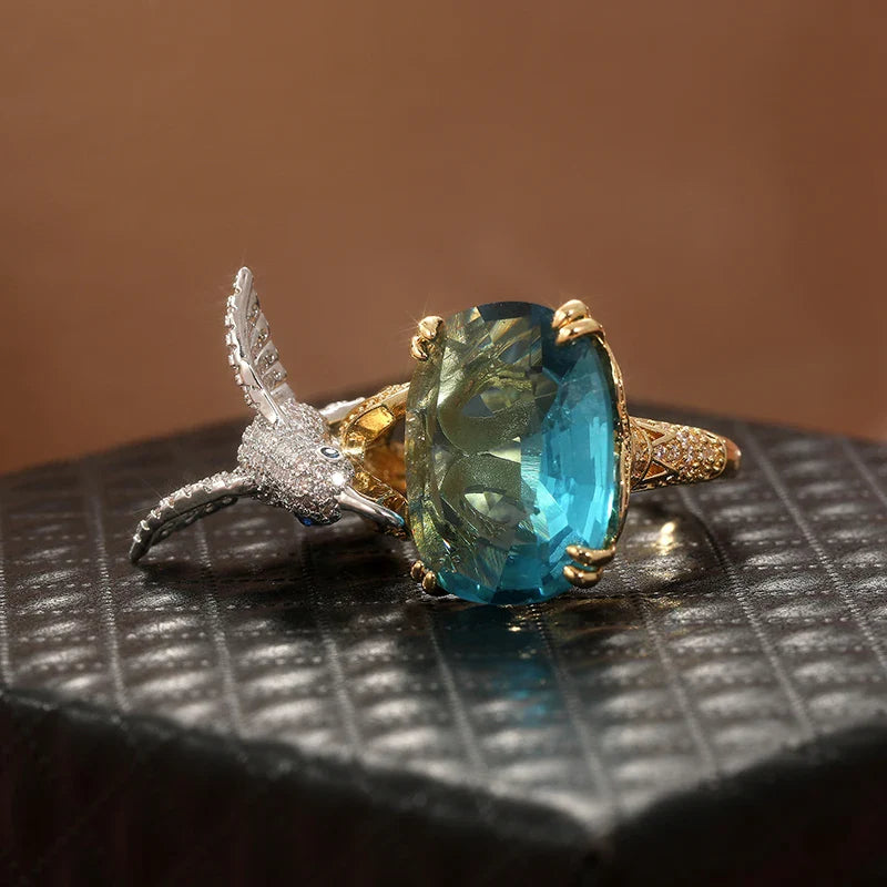 Anillo Ajustable de Colibrí Color Aguamarina – Baño de Oro de 14K